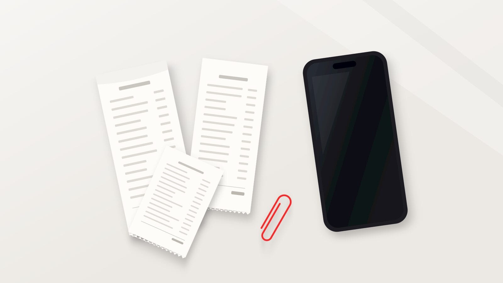 Unos recibos de papel, un clip rojo y un iPhone con la pantalla apagada sobre un escritorio gris claro y cálido